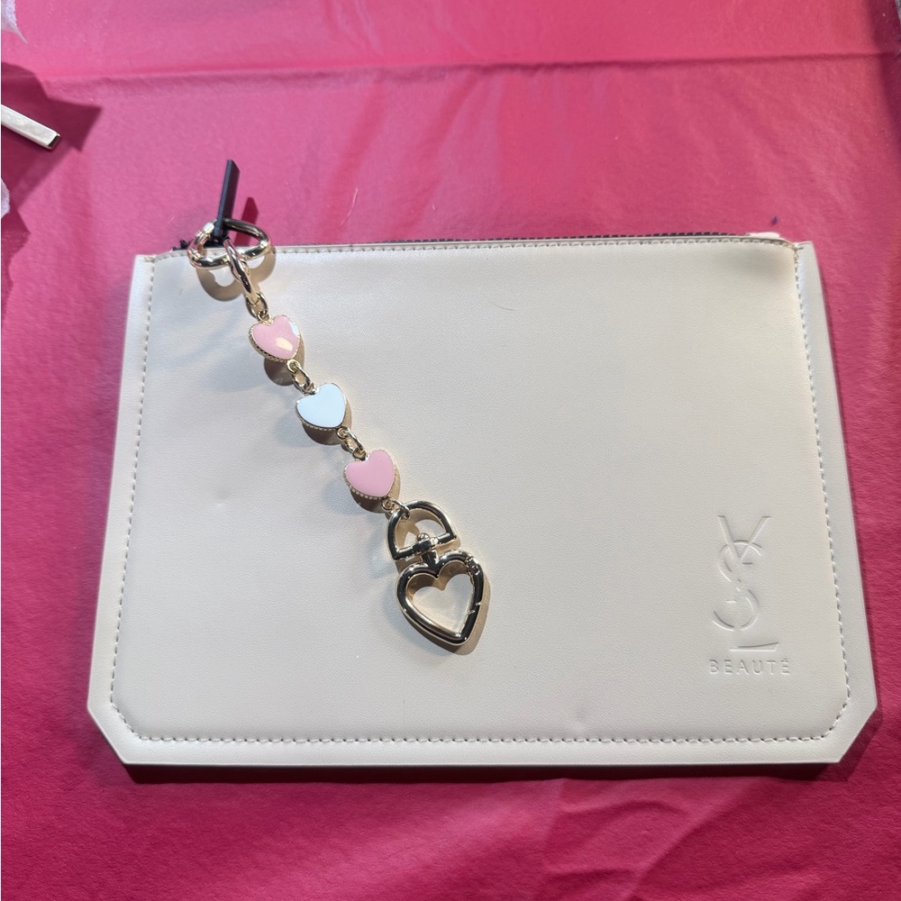 YSL Beauté beige makeup pouch. With purse chain extender.
